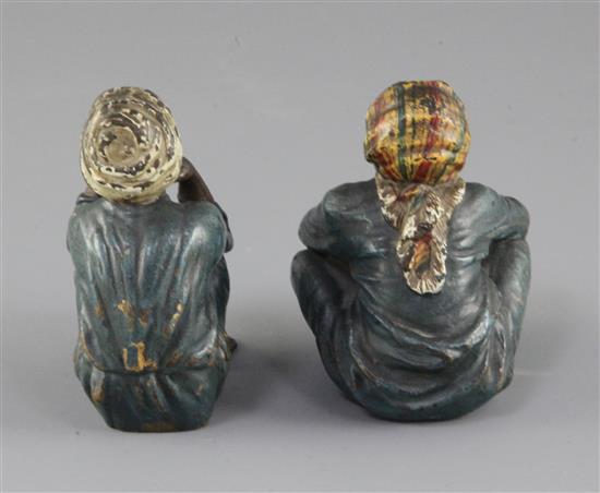 A pair of Franz Bergman cold painted bronze figures of seated Arab children, 2.75in.